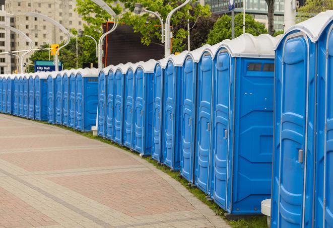 a row of portable restrooms at a fairground, offering visitors a clean and hassle-free experience in poncacity